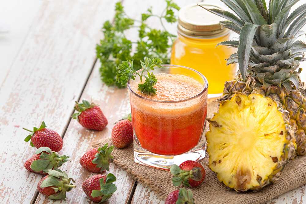 image Refreshing Strawberry and Pineapple Summer Cocktail